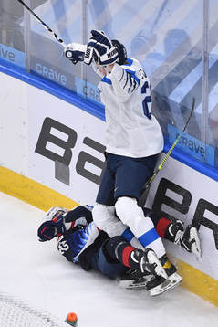 Samuel Helenius of Finland collides with Ryan Johnson of USA