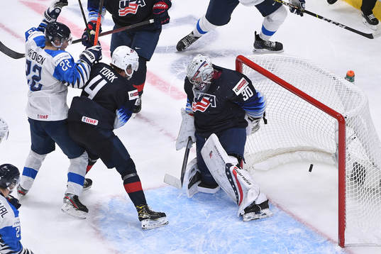 Roni Hirvonen of Finland watches the puck enter the USA net