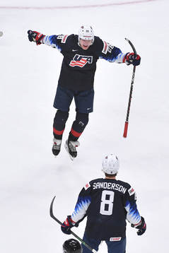 Arthur Kaliyev of USA leaps in the air in celebration with