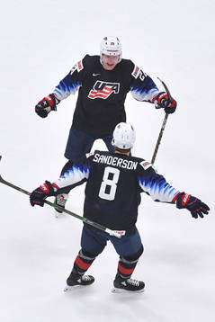 Arthur Kaliyev of USA celebrates with teammate Jake
