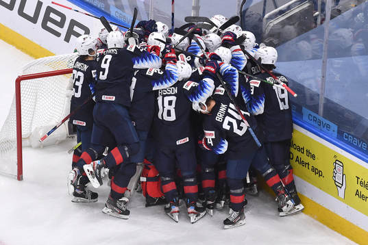 Team USA celebrates their 4-3 victory