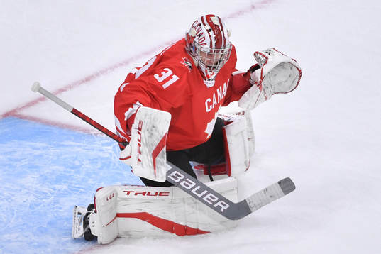 Dylan Garand of Canada participates in warm up