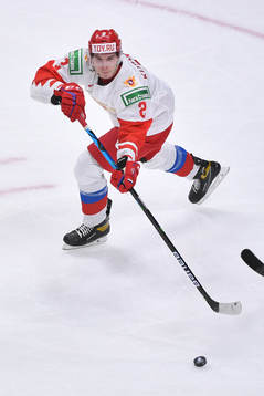 Yan Kuznetsov of Russia passes the puck