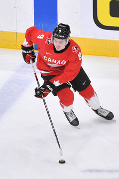 Connor Zary of Canada participates in warm up