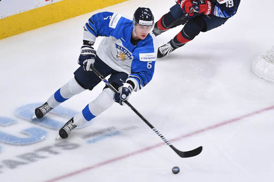 Eemil Viro of Finland skates with the puck