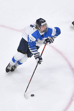 Brad Lambert of Finland skates with the puck