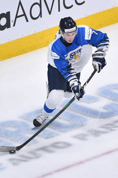 Topi Niemela of Finland skates with the puck