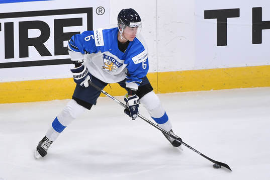 Eemil Viro of Finland handles the puck