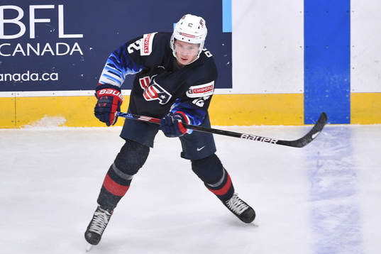 Matthew Boldy of USA passes the puck