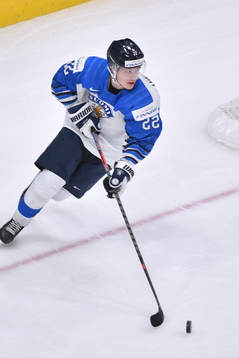 Roni Hirvonen of Finland skates with the puck