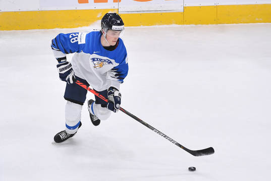 Henri Nikkanen of Finland skates with the puck