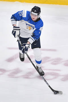 Samuel Helenius of Finland skates with the puck