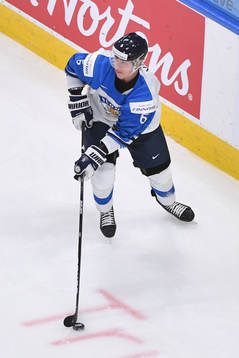 Eemil Viro of Finland skates with the puck
