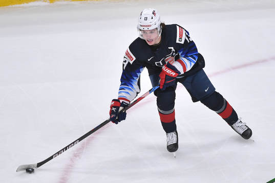 Cole Caufield of USA skates