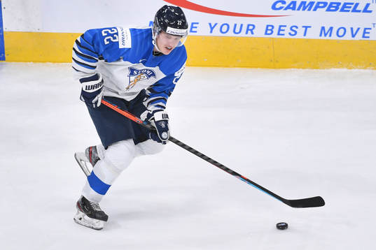 Roni Hirvonen of Finland skates with the puck