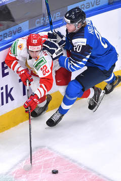 Samuel Helenius of Finland collides with Marat Khusnutdinov