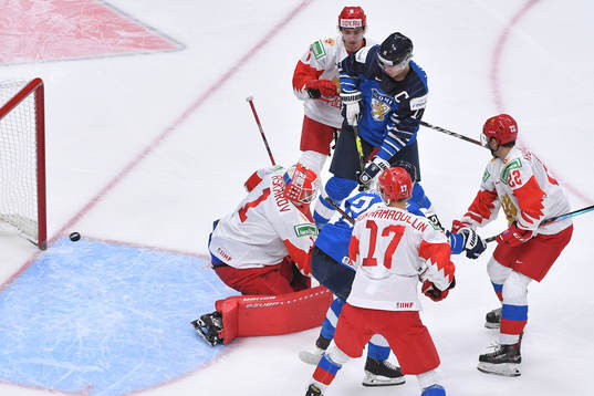 Anton Lundell of Finland fends of Semyon Chistyakov, Shakir