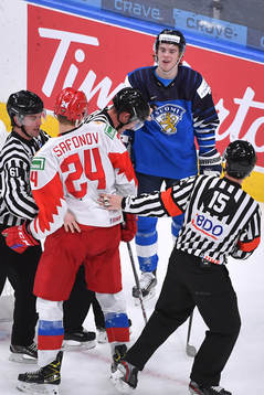 Topi Niemela of Finland exchanges words with Ilya Safonov