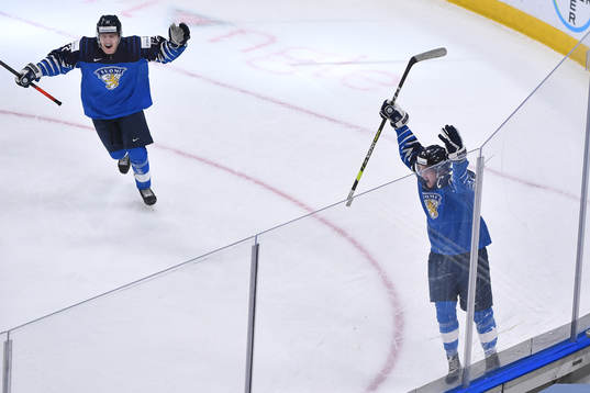Anton Lundell and Roni Hirvonen of Finland celebrate the