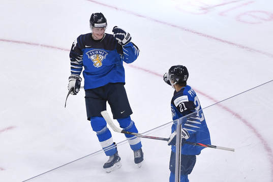 Mikael Pyyhtia and Juuso Parssinen of Finland celebrate the