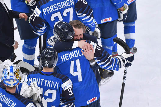 Team Finland Head Coach Antti Pennanen hugs Ville Heinola