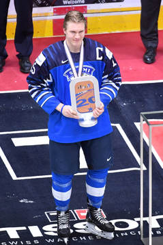 Anton Lundell of Finland poses with the third place trophy