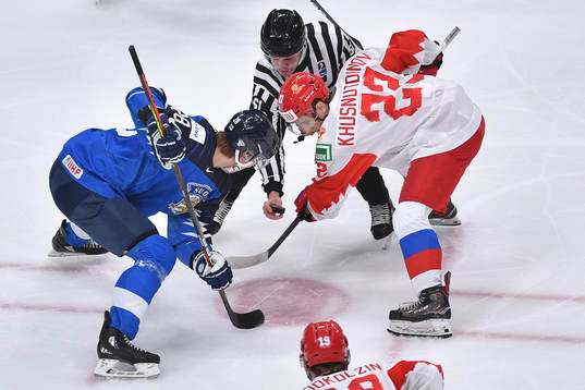 Henri Nikkanen of Finland takes a face off against Marat