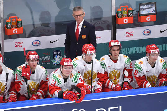 Team Russia Head Coach Igor Larionov looks towards the ice