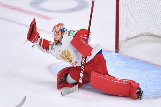Yaroslav Askarov of Russia makes a glove save