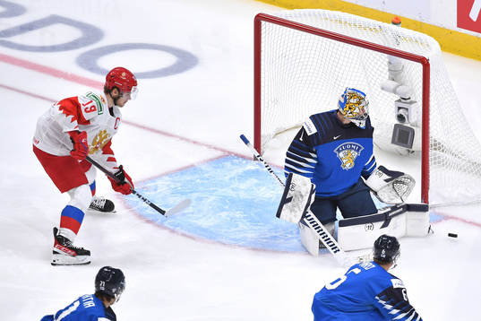 As Vasili Podkolzin of Russia advances towards the net Kari