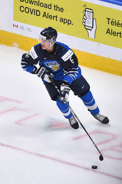 Eemil Viro of Finland skates with the puck