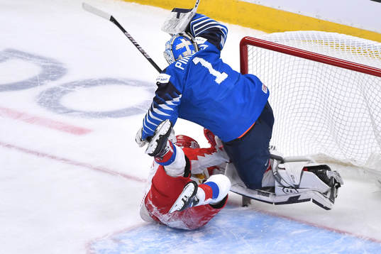 Vasili Ponomaryov of Russia collides with Kari Piiroinen of