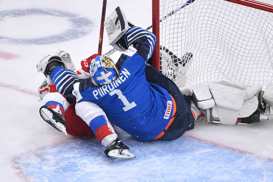 Vasili Ponomaryov of Russia collides with Kari Piiroinen of