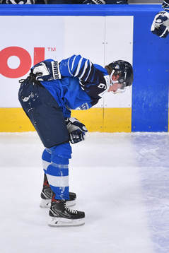 Eemil Viro of Finland bends forward holding his back