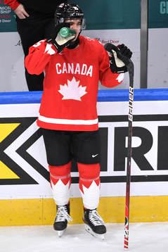 Alex Newhook of Canada takes a water break