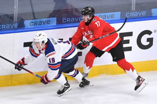 Connor McMichael of Canada pushes Patrick Moynihan of USA