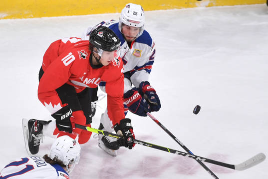 Dylan Holloway of Canada and Landon Slaggert of USA battle