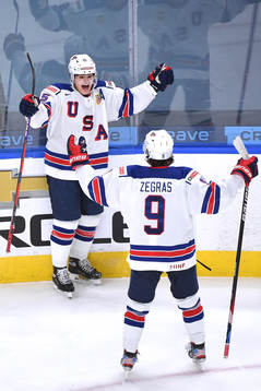 Alex Turcotte and Trevor Zegras of USA celebrate the 1-0