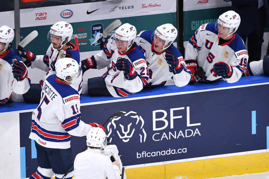 Alex Turcotte of USA celebrates the 1-0 goal at the  bench