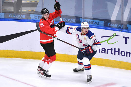 Peyton Krebs of Canada collides with Brock Faber of USA