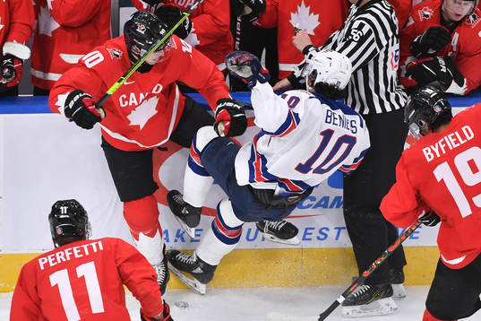 Dylan Holloway of Canada collides with Matthew Beniers of