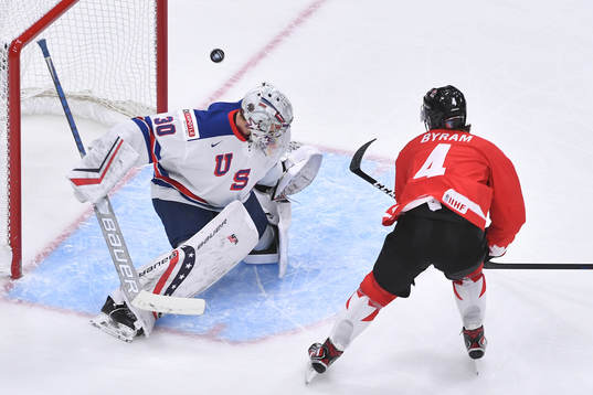 Spencer Knight of USA makes a save off Bowen Byram of Canada