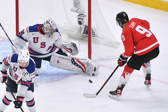 Spencer Knight of USA makes a third period save