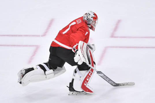 Devon Levi of Canada leaves his net for an extra attacker