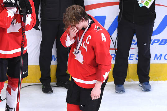 Bowen Byram of Canada hangs his head in disappointment