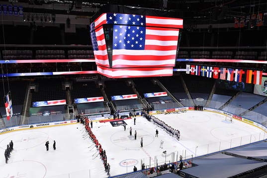 Team Canada and Team USA stand for the USA national anthem