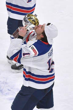 Brock Faber of USA kisses the championship trophy