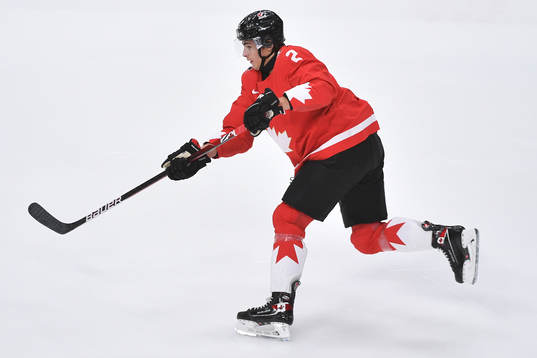 Braden Schneider of Canada shoots