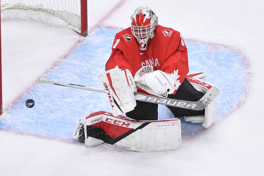 Devon Levi of Canada makes a blocker save