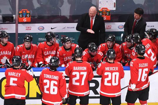 Team Canada Head Coach Andre Tourigny speaks to his players